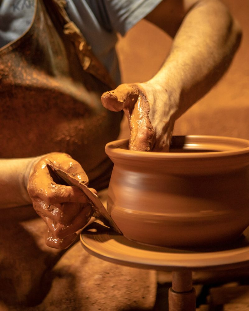 Craftsman making pottery