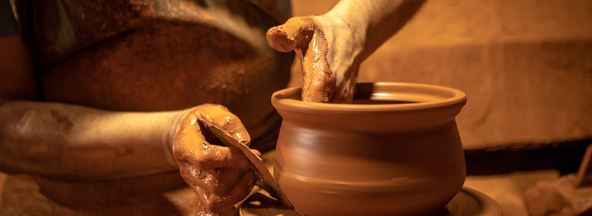 Craftsman making pottery