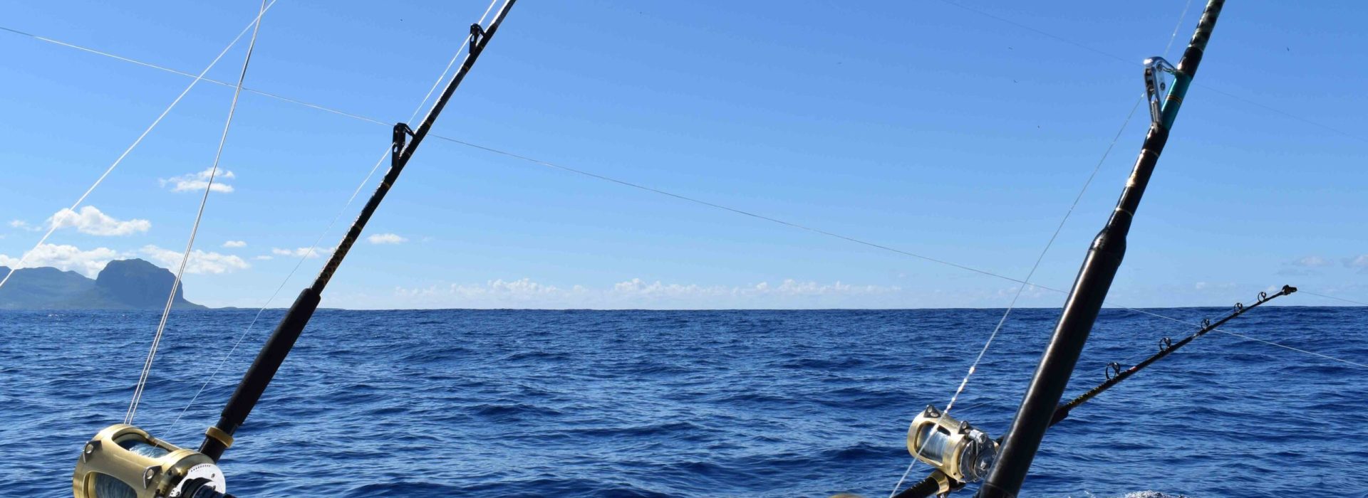 Fishing rods set on a boat for a big game fishing trip. Leisure,