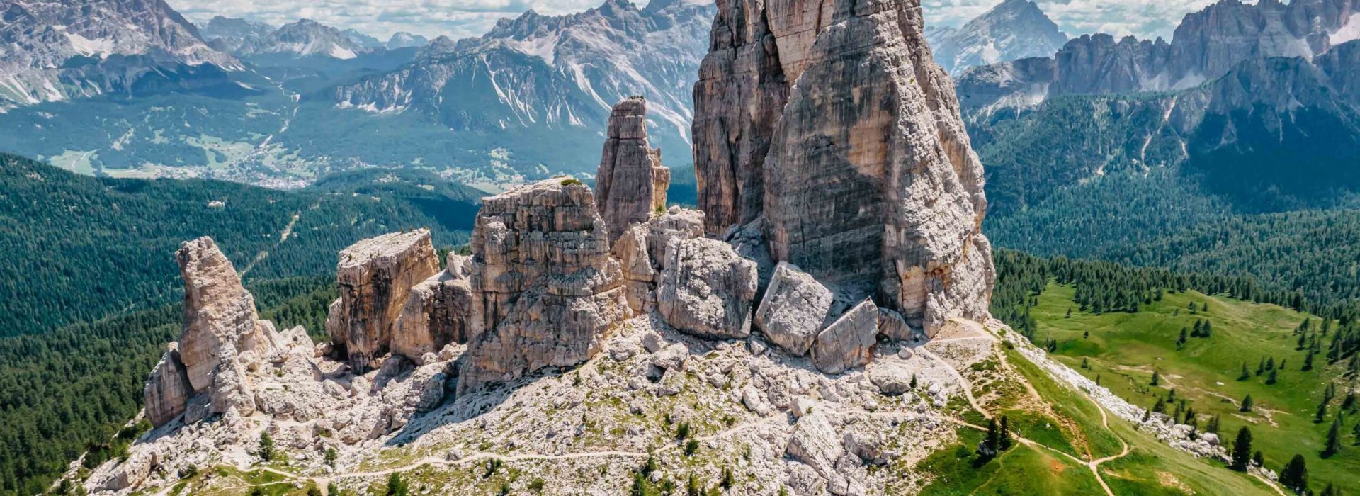 Climbing in Cinque Torri,Dolomites,Italy.Five towers and rock formations close to Cortina d'Ampezzo attract many tourists.Picturesque Dolomite Alps,active summer holiday,steep cliffs.Adventure concept