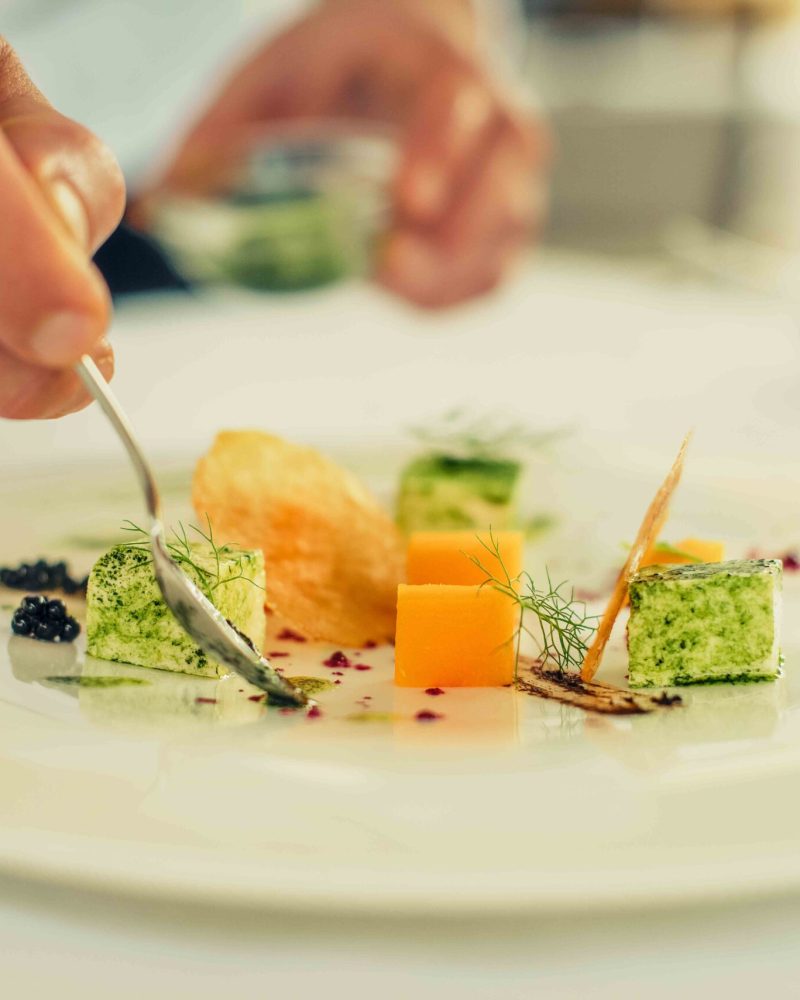 close-up-man-preparing-food-plate